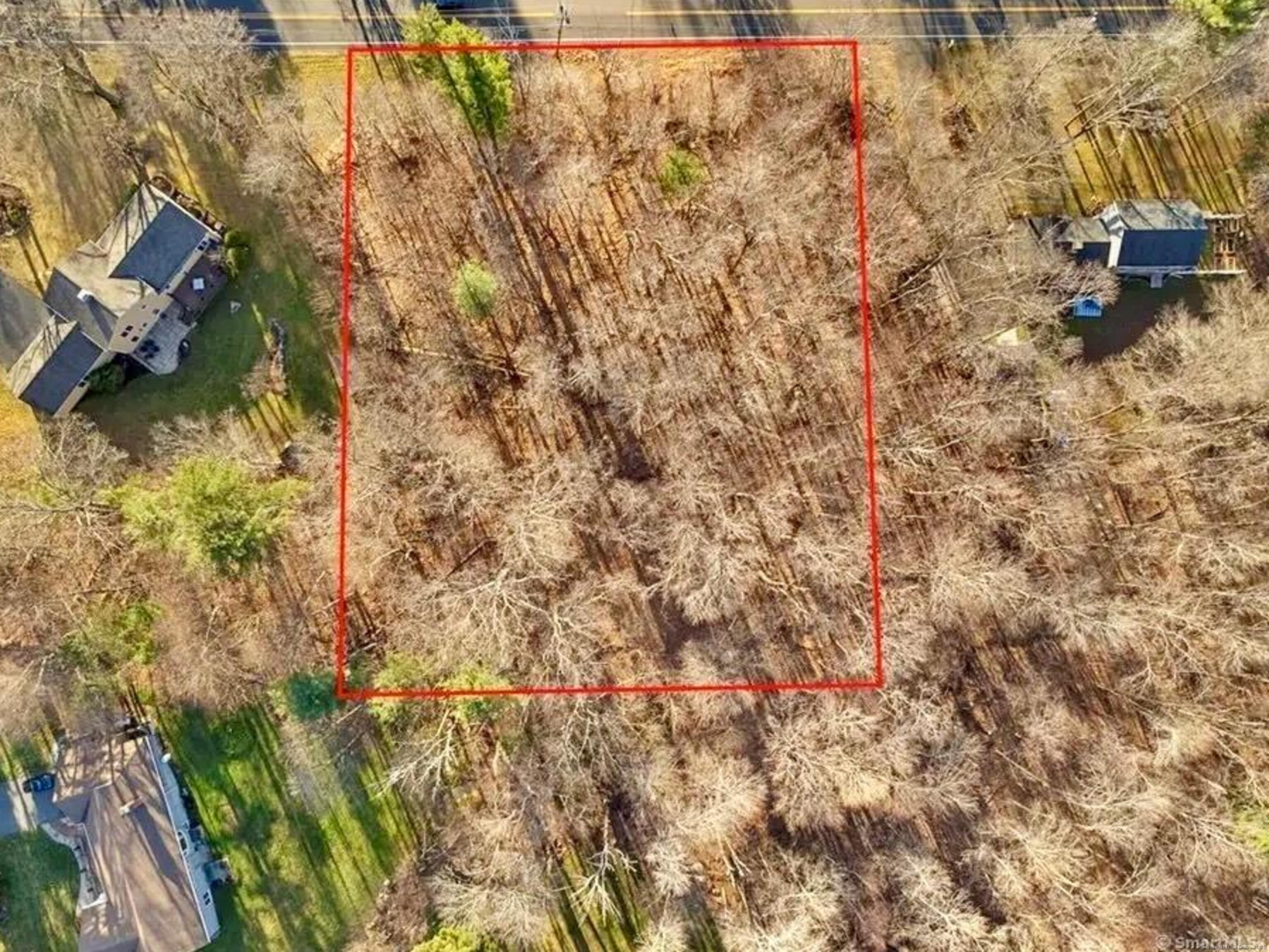 142 Turnpike Road Somers, CT 06071 - Photo 7 of 9 a backyard of a building with large trees