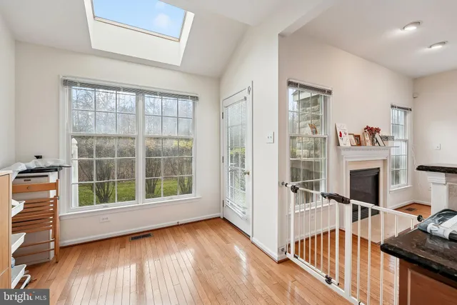 a view of a livingroom with furniture and staircase