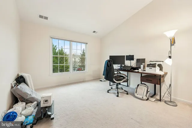 a view of workspace with gym equipment and a window