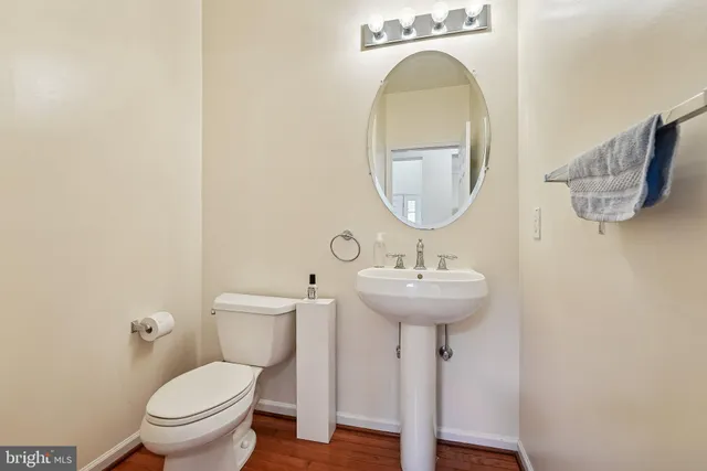 a bathroom with a sink a mirror and a toilet