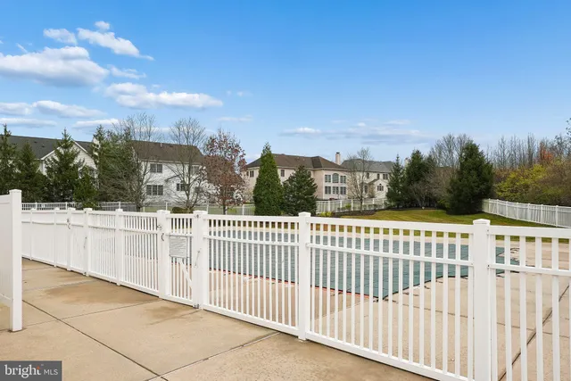a view of a wrought iron fences in front of house