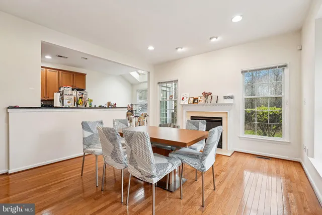 a dining room with furniture and a fireplace