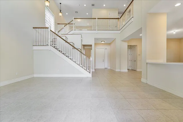 a view of entryway and hall with a front door