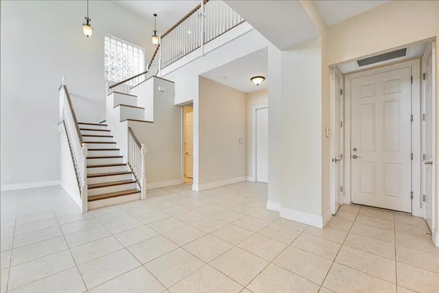 an empty space with white walls and stairs