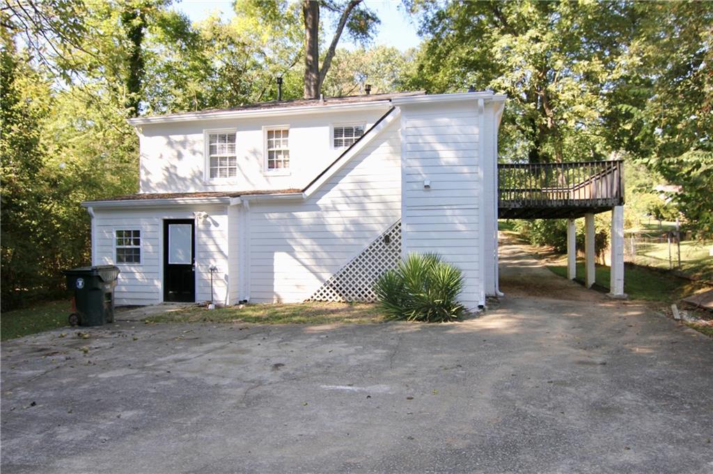 2187 Plantation Lane, Unit B Chamblee, GA 30341 - Photo 1 of 25 a view of a house with a yard and tree s