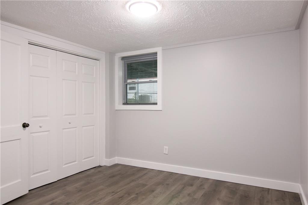 2187 Plantation Lane, Unit B Chamblee, GA 30341 - Photo 13 of 25 wooden floor in an empty room