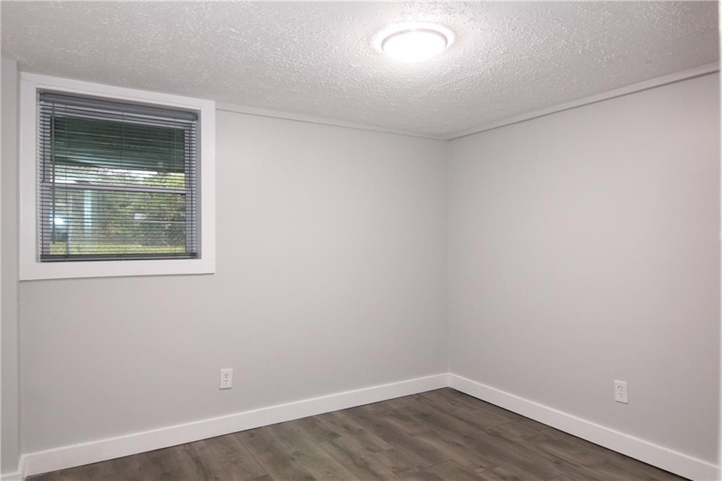 2187 Plantation Lane, Unit B Chamblee, GA 30341 - Photo 14 of 25 an empty room with a window