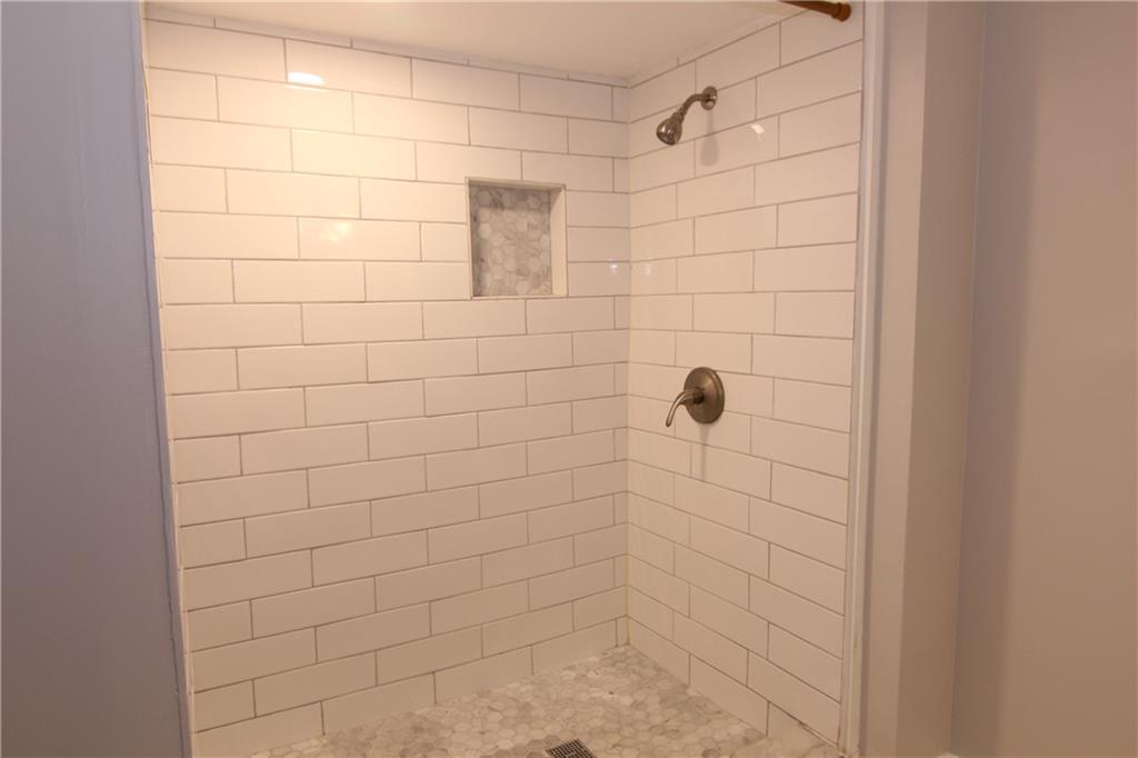 2187 Plantation Lane, Unit B Chamblee, GA 30341 - Photo 18 of 25 a bathroom with a shower
