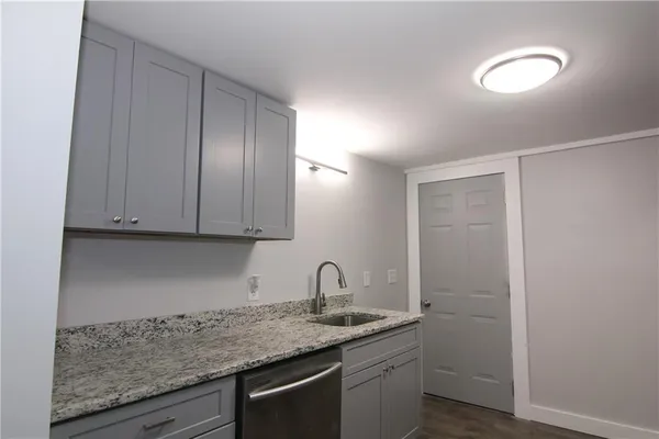a view of a sink and cabinets