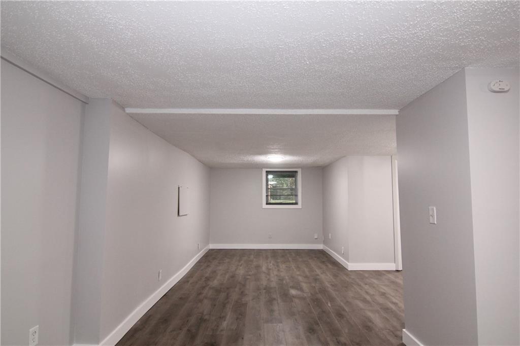 2187 Plantation Lane, Unit B Chamblee, GA 30341 - Photo 10 of 25 wooden floor in an empty room