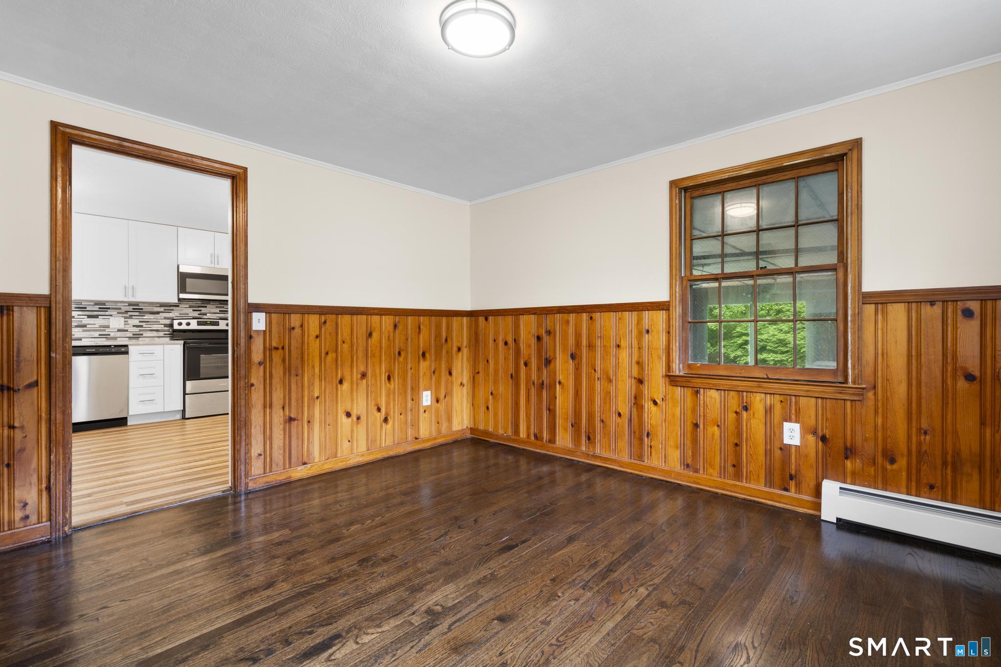 7 Sycamore Terrace Windham, CT 06280 - Photo 16 of 40 a view of an empty room with wooden floor and a window