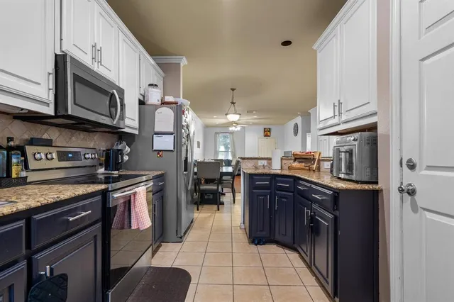 a bathroom with a sink mirror and vanity