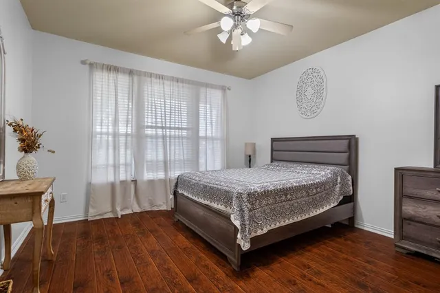 a room with a bed and a table in it