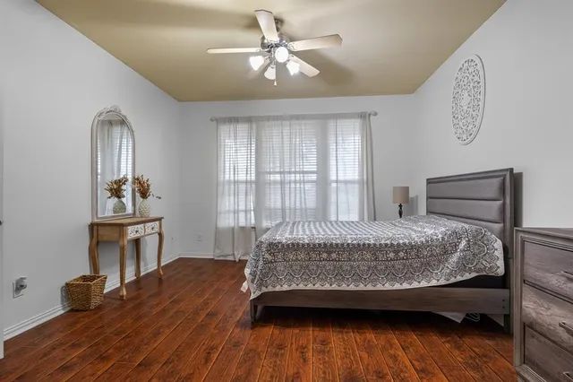 a bedroom with a bed and a table in it