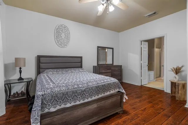a spacious bathroom with a double vanity sink and a mirror