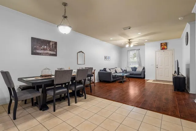 a kitchen with stainless steel appliances kitchen island granite countertop refrigerator and cabinets