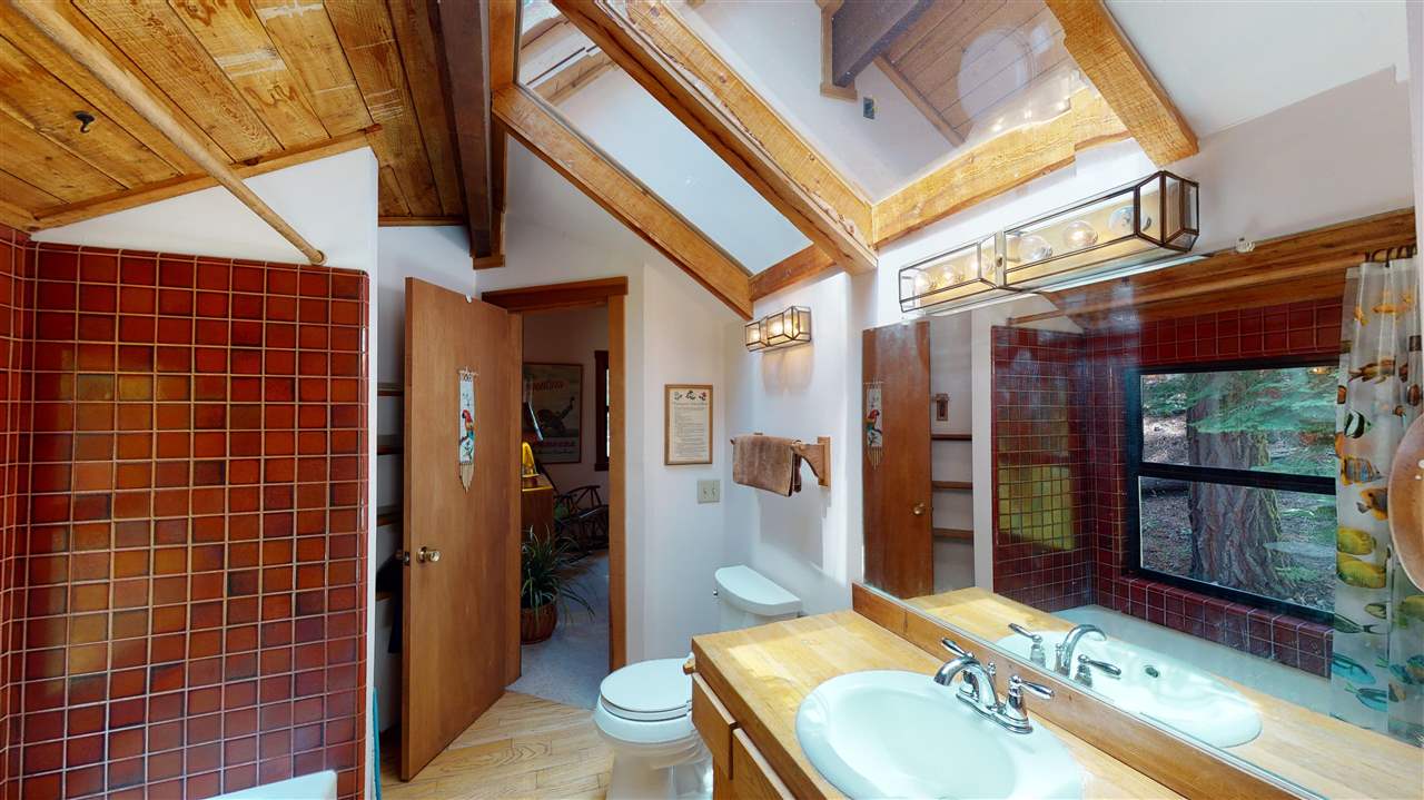 1069 Snow Crest Road Alpine Meadows, CA 96146 - Photo 9 of 20 a bathroom with a sink a toilet and shower