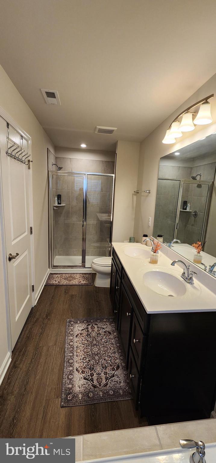 104 Commerce Sicklerville, NJ 08081 - Photo 13 of 16 a bathroom with a sink and a mirror