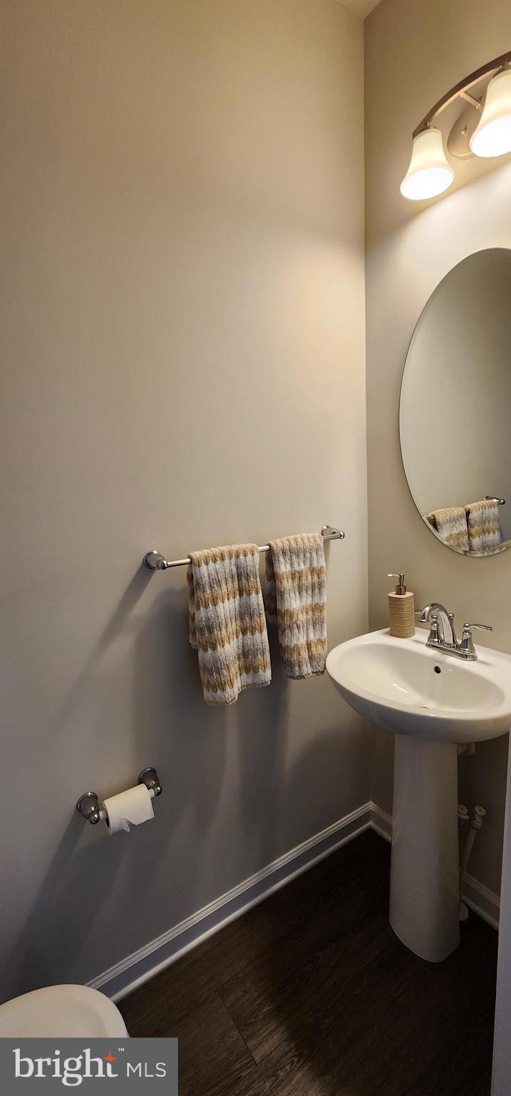 104 Commerce Sicklerville, NJ 08081 - Photo 4 of 16 a bathroom with a sink and mirror