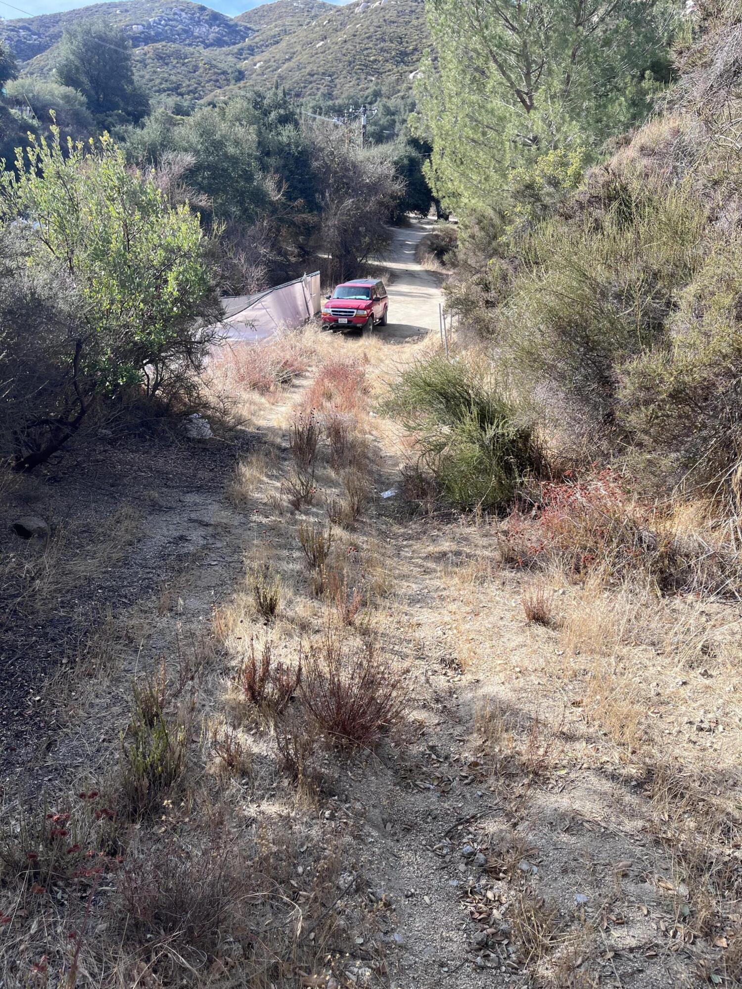 0 Partridge Street Banning, CA 92220 - Photo 4 of 5 a backyard of a house with lots of green space and fog