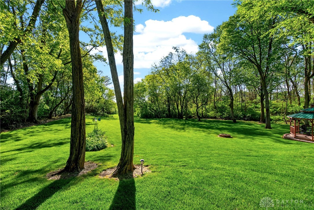 330 South Alpha Bellbrook Road Bellbrook, OH 45305 - Photo 58 of 87 This lush yard offers a private retreat with ample green space and a charming gazebo.