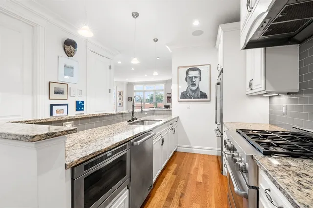 a kitchen with a stove and a sink