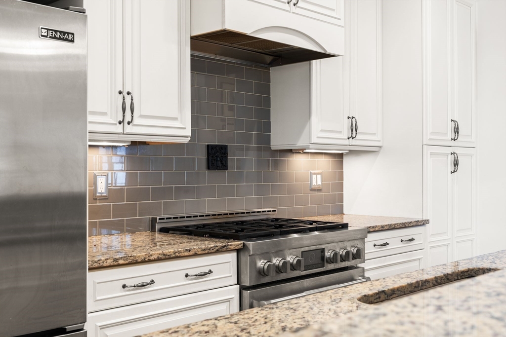 3 M Street, Unit 3 Boston, MA 02127 - Photo 14 of 34 a stove top oven sitting inside of a kitchen