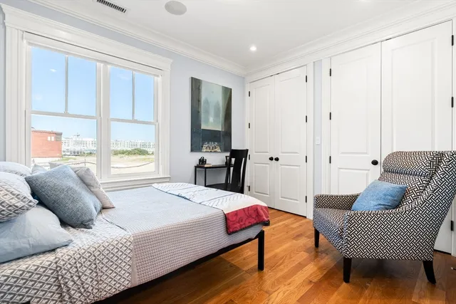 a spacious bedroom with a bed and a couch