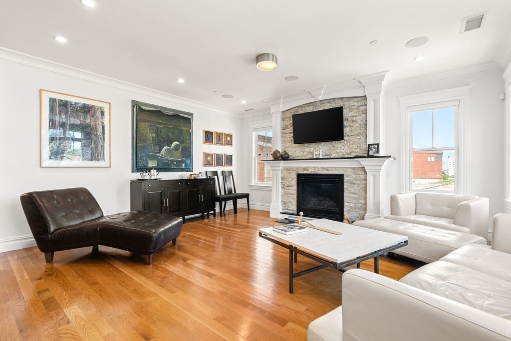 3 M Street, Unit 3 Boston, MA 02127 - Photo 2 of 34 a living room with furniture fireplace and flat screen tv