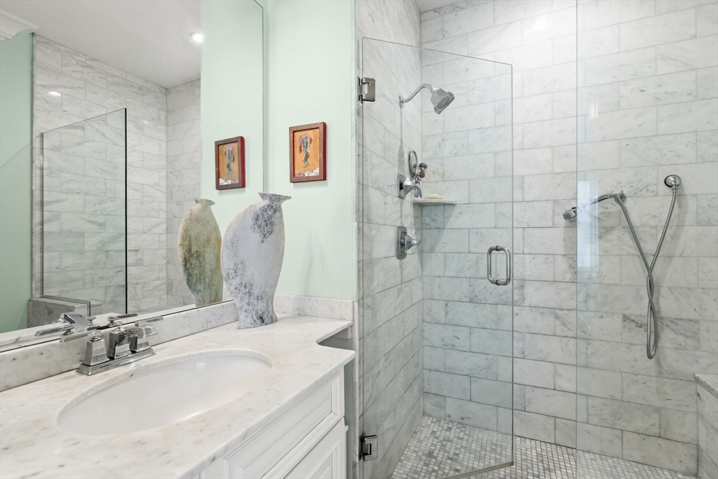 3 M Street, Unit 3 Boston, MA 02127 - Photo 22 of 34 a bathroom with a granite countertop shower sink and mirror
