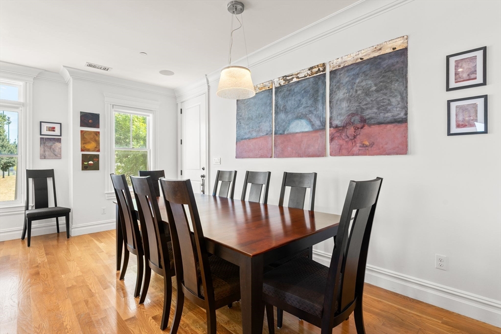 3 M Street, Unit 3 Boston, MA 02127 - Photo 8 of 34 a view of a dining room with furniture window and wooden floor
