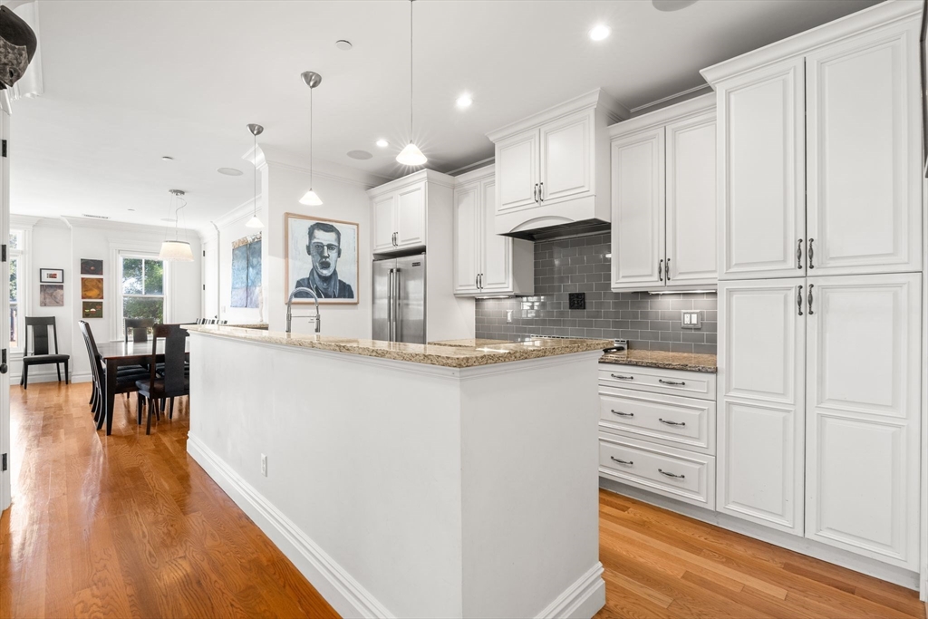 3 M Street, Unit 3 Boston, MA 02127 - Photo 10 of 34 a kitchen with kitchen island a counter top space a sink stainless steel appliances and cabinets