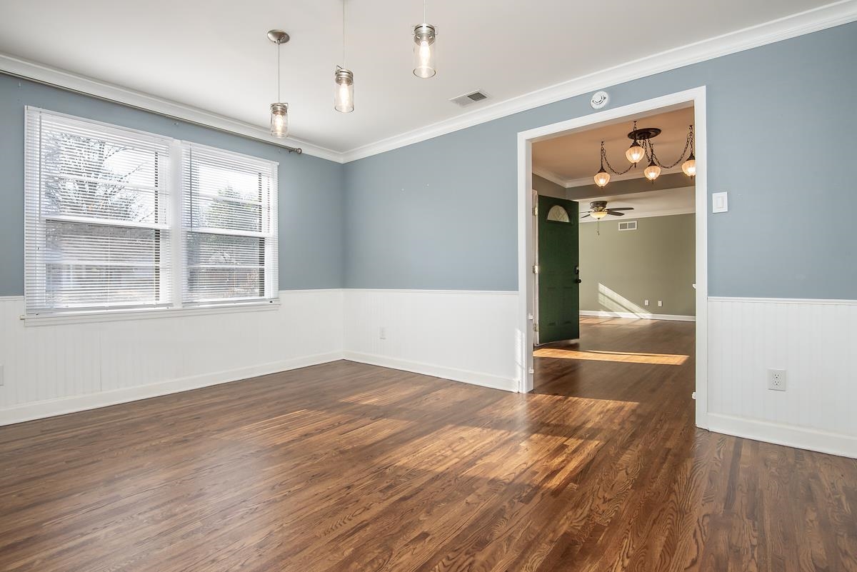 4628 Boyce Road Memphis, TN 38117 - Photo 11 of 25 wooden floor in an empty room with a window