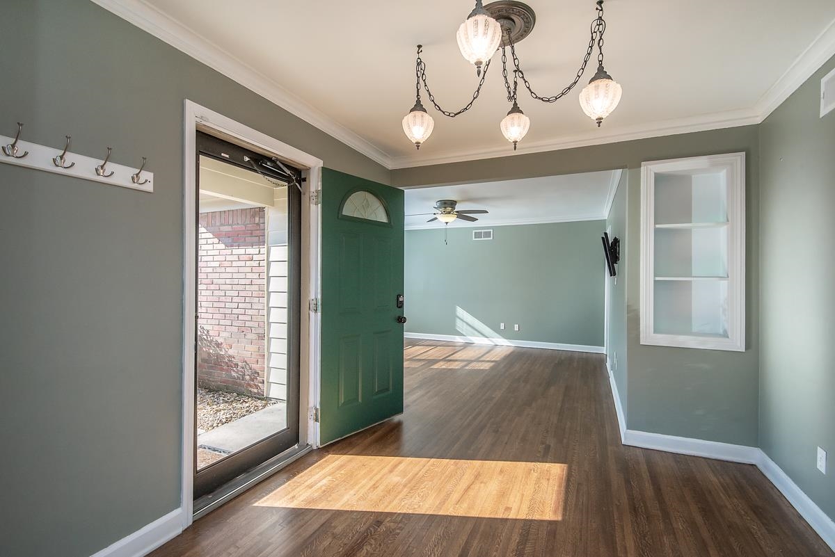 4628 Boyce Road Memphis, TN 38117 - Photo 12 of 25 a view of a room with wooden floor and door