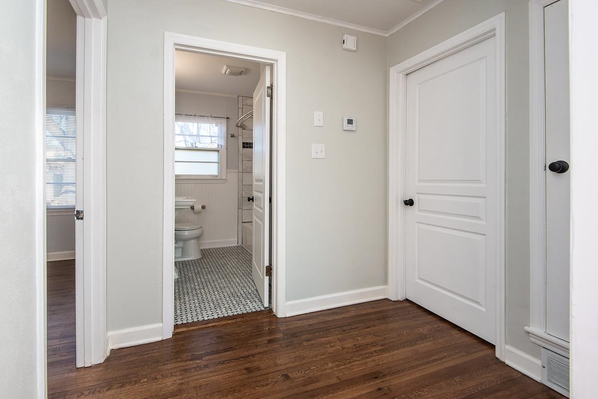 4628 Boyce Road Memphis, TN 38117 - Photo 18 of 25 a view of a bathroom with a glass door and a wooden floor
