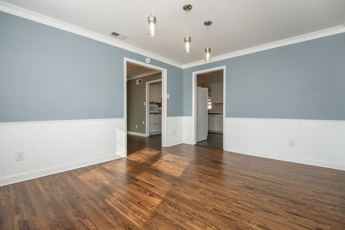 4628 Boyce Road Memphis, TN 38117 - Photo 10 of 25 wooden floor in an empty room with a window