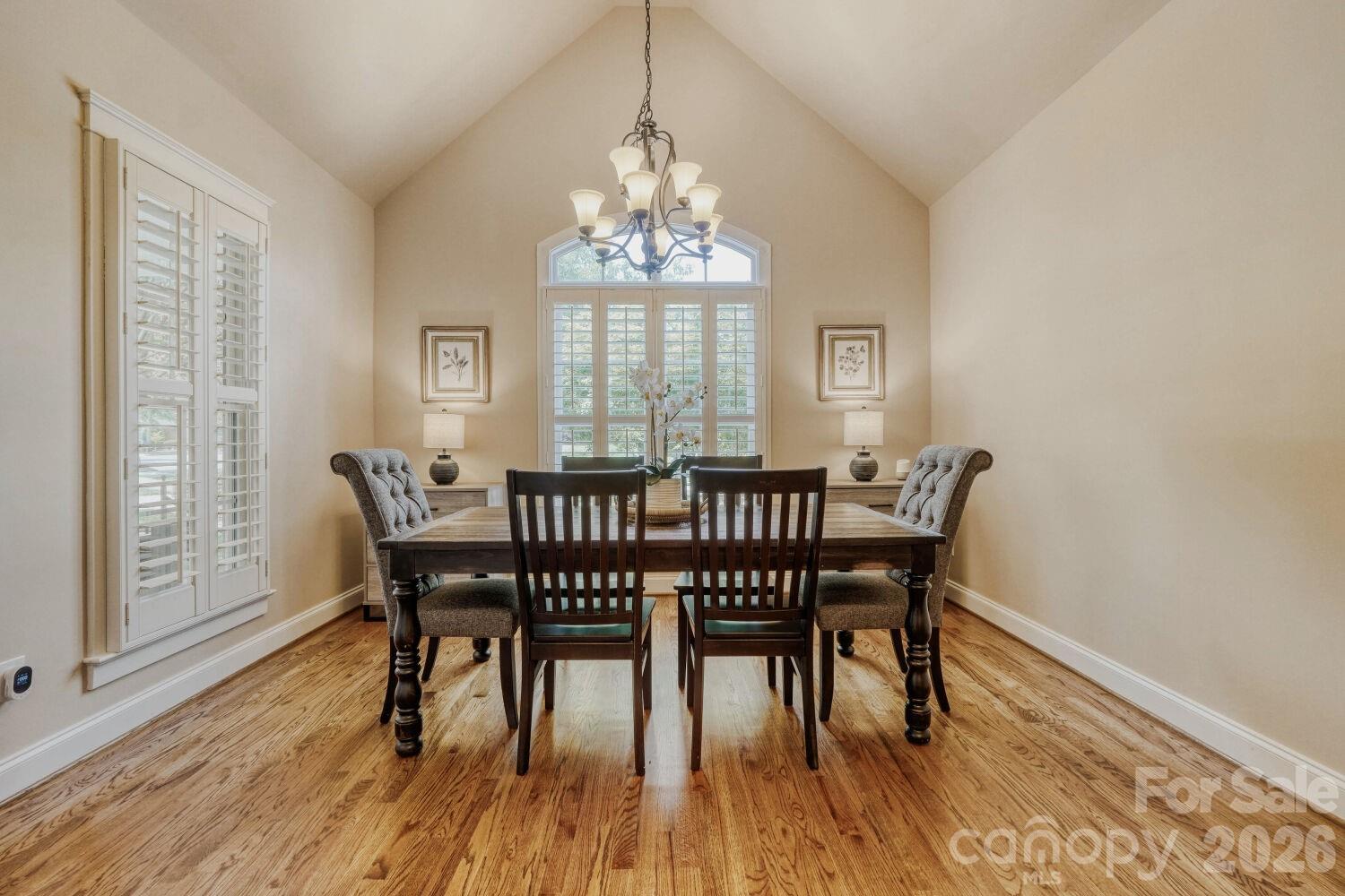 183 Lavender Bloom Loop Mooresville, NC 28115 - Photo 12 of 46 a view of a dining room with furniture window and wooden floor