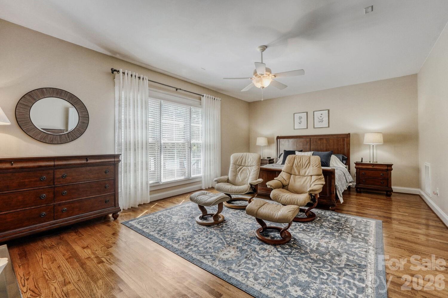 183 Lavender Bloom Loop Mooresville, NC 28115 - Photo 16 of 46 a living room with furniture and wooden floor