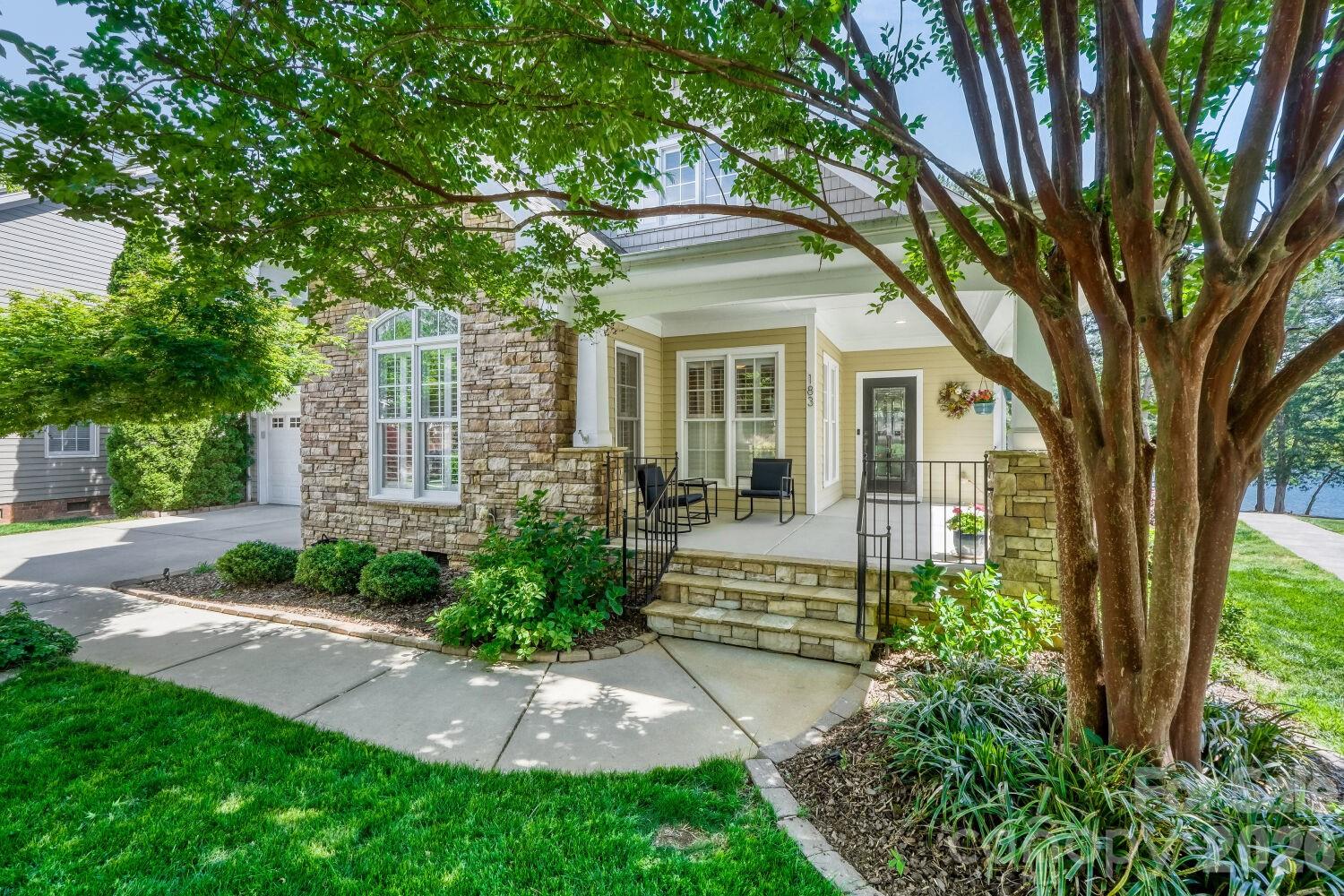 183 Lavender Bloom Loop Mooresville, NC 28115 - Photo 2 of 46 a front view of a house with a garden