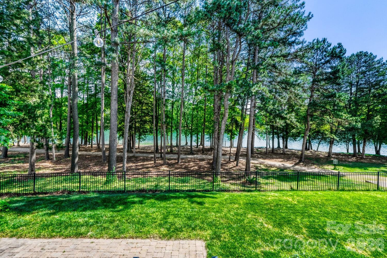 183 Lavender Bloom Loop Mooresville, NC 28115 - Photo 21 of 46 a view of a park with trees in the background
