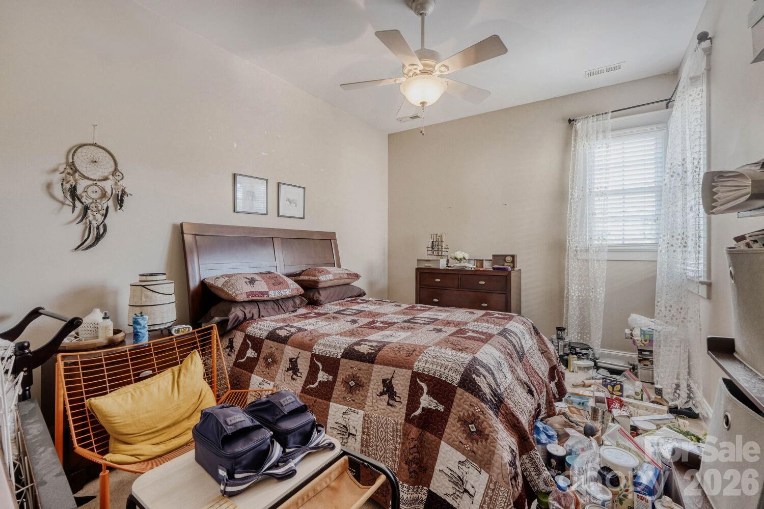 183 Lavender Bloom Loop Mooresville, NC 28115 - Photo 25 of 46 a bedroom with a bed and wooden floor