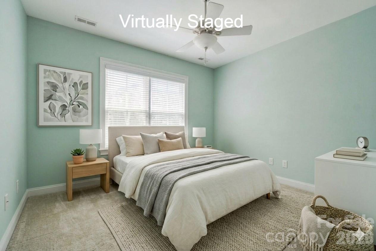 183 Lavender Bloom Loop Mooresville, NC 28115 - Photo 26 of 46 a bedroom with a bed and a window