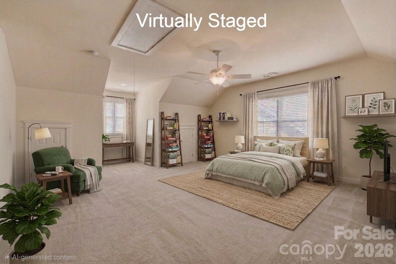 183 Lavender Bloom Loop Mooresville, NC 28115 - Photo 29 of 46 a spacious bedroom with a bed a couch and potted plant