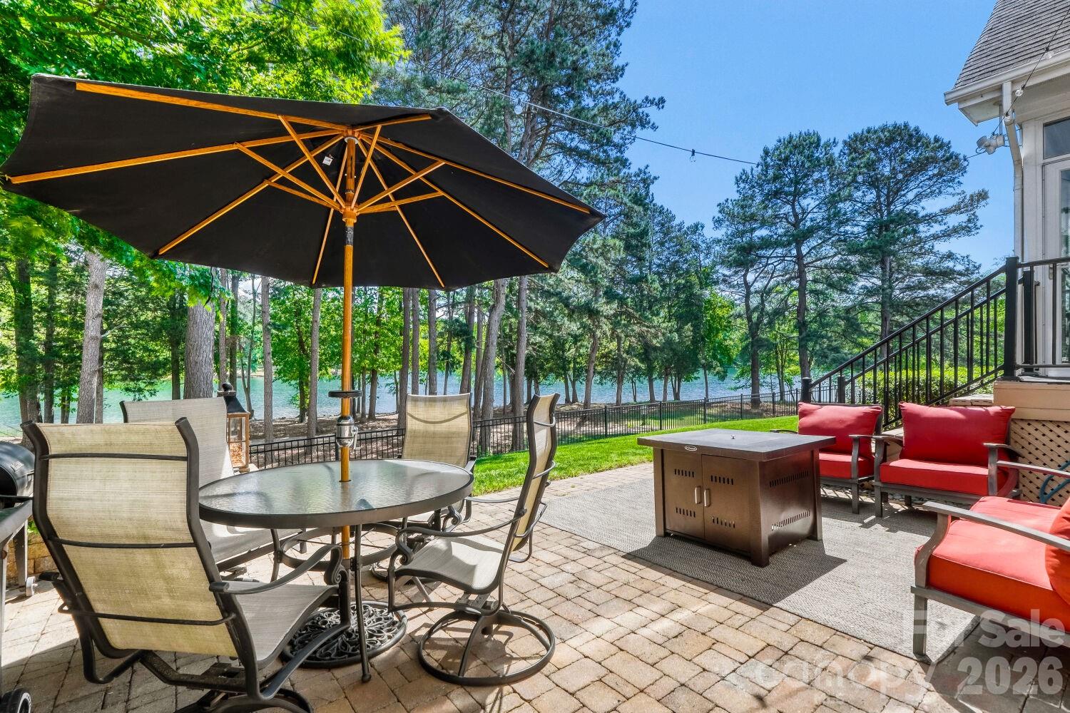 183 Lavender Bloom Loop Mooresville, NC 28115 - Photo 3 of 46 a patio with a patio table and chairs