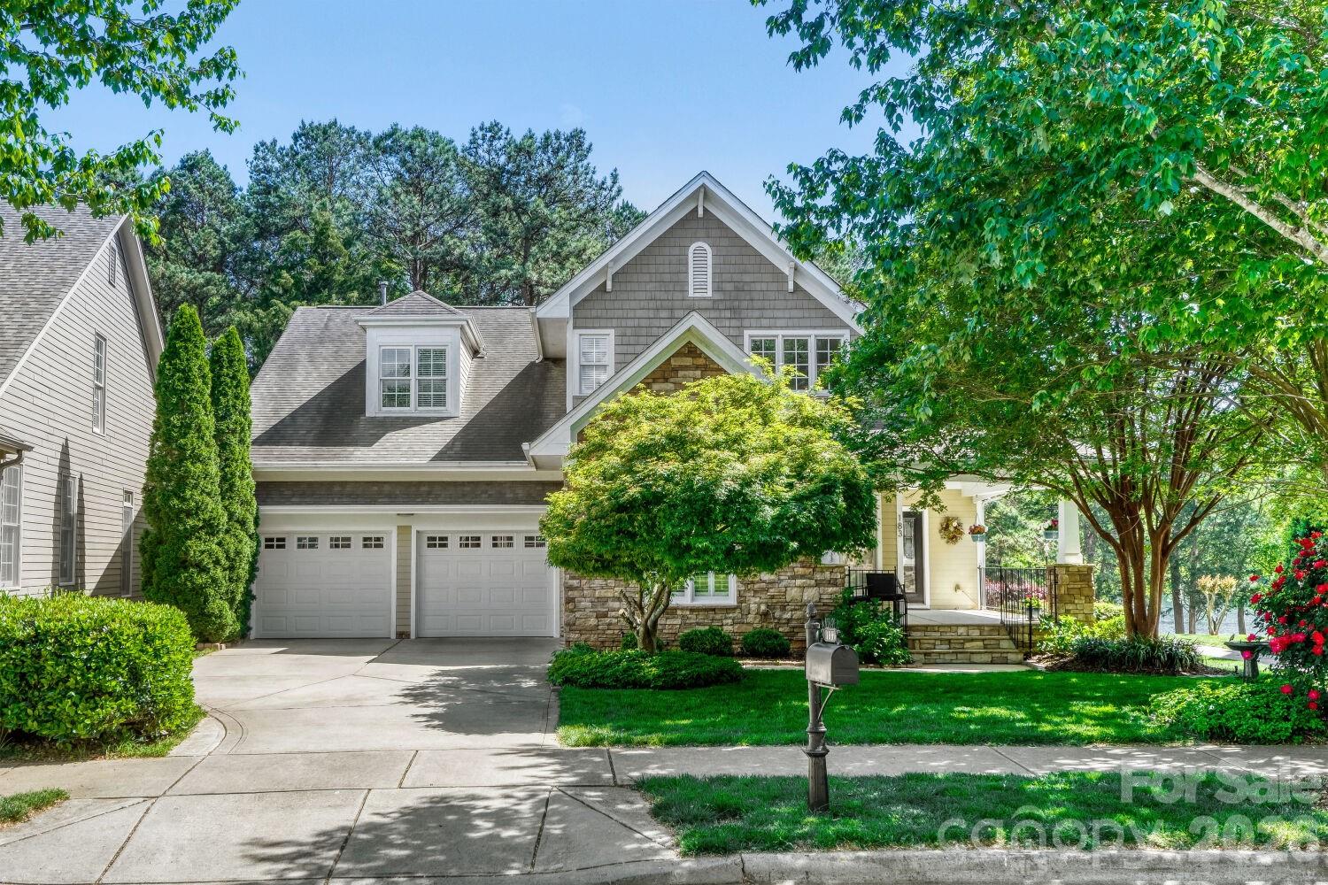 183 Lavender Bloom Loop Mooresville, NC 28115 - Photo 5 of 46 a front view of a house with a garden