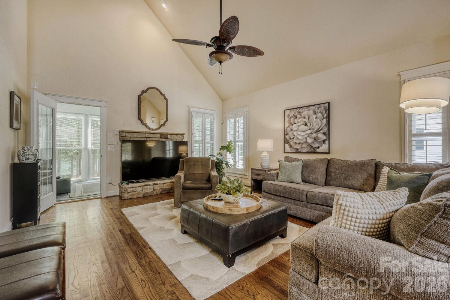 183 Lavender Bloom Loop Mooresville, NC 28115 - Photo 7 of 46 a living room with furniture a fireplace and a flat screen tv