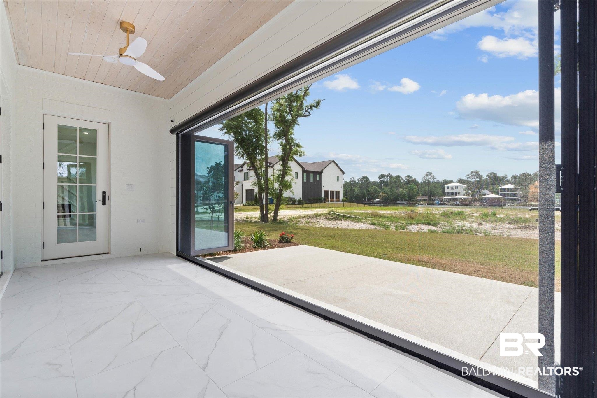 853 Inlet Circle Gulf Shores, AL 36542 - Photo 20 of 55 Interior space featuring ceiling fan, wood ceiling, and marble finish floor