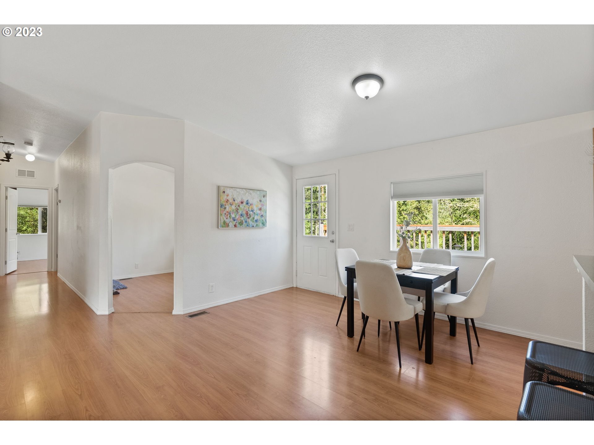 69084 Nicolai Road Rainier, OR 97048 - Photo 6 of 30 a view of a dining room with furniture and wooden floor