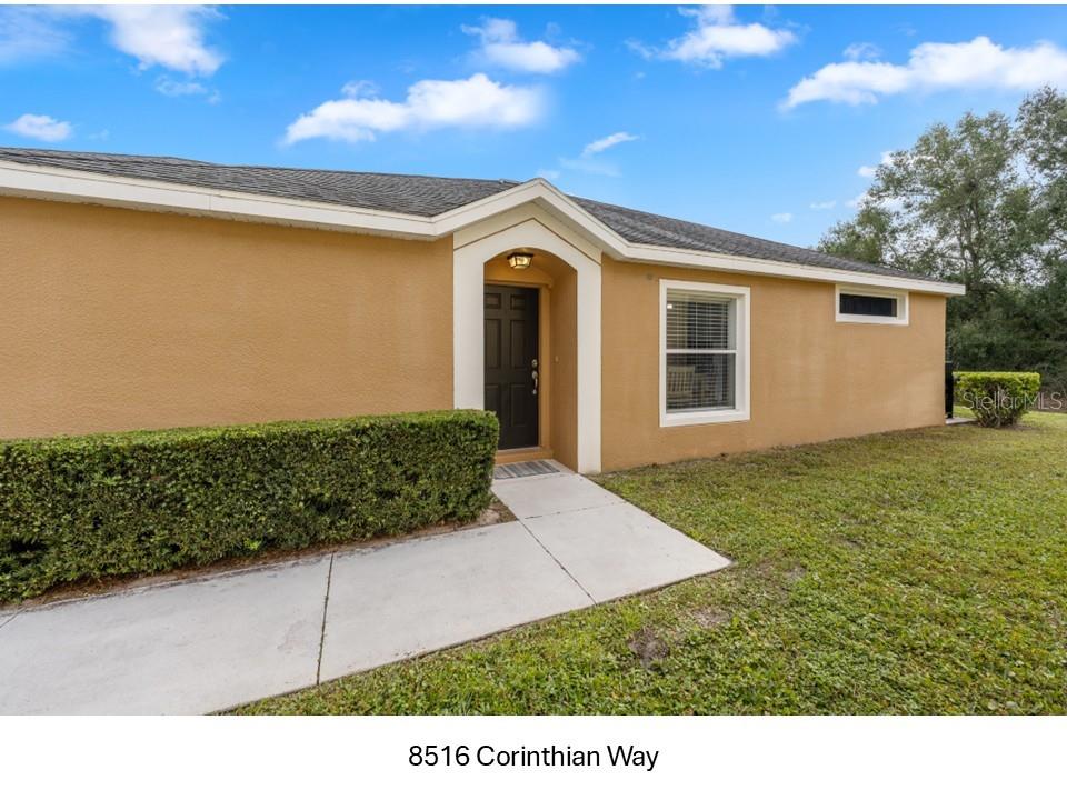 8516 Corinthian Way New Port Richey, FL 34654 - Photo 1 of 24 a view of an house with backyard and garden