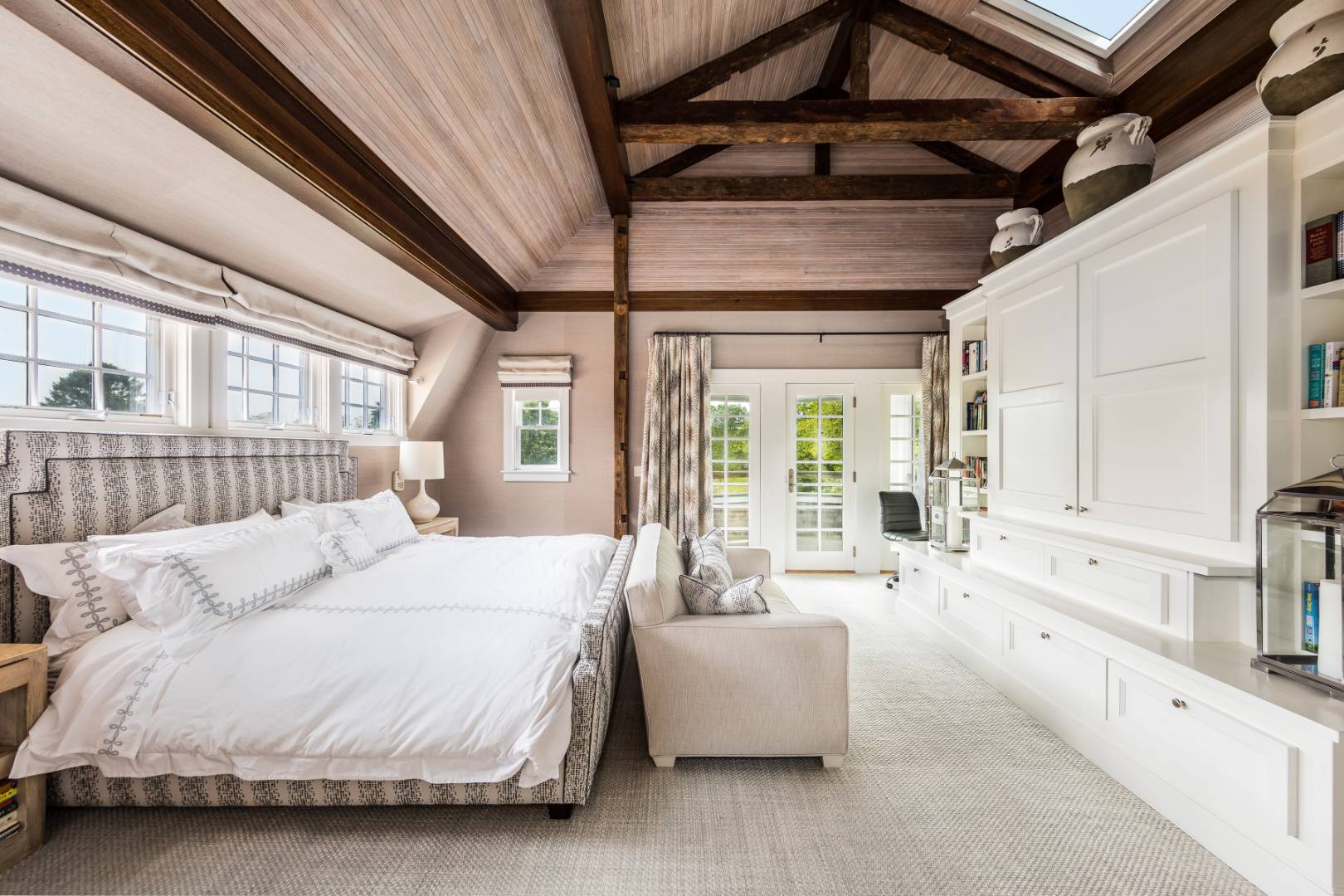 30 Jones Road East Hampton, NY 11937 - Photo 11 of 21 a spacious bedroom with a bed couch and a large window